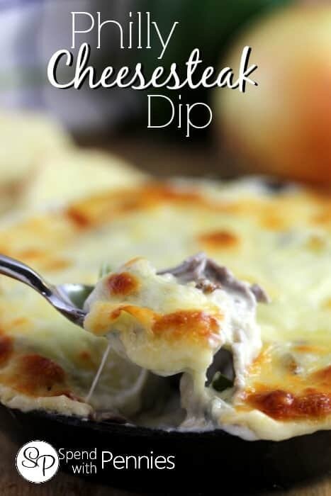 a spoon full of Philly Cheesesteak Dip with melted browned cheese