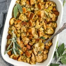 stuffing in a pan with herbs and a spoon