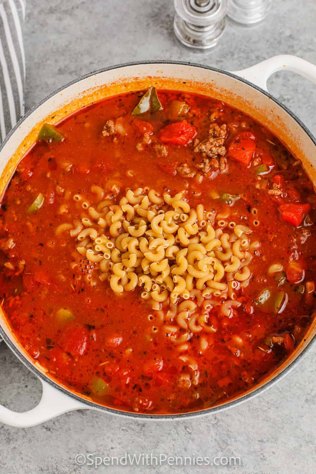 adding elbow macaroni to goulash