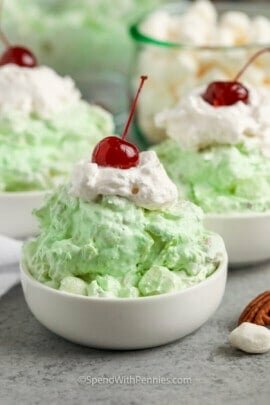 Watergate Salad with whipped cream and a cherry on top