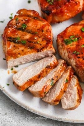 BBQ Pork Chops sliced on a plate